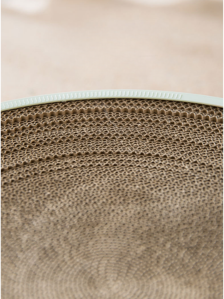 Nail sharpener with disk-shaped ball toy